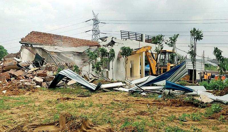 Farmhouses built without nod razed